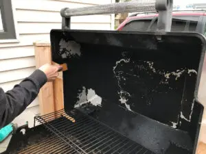 Scrape grease build-up off your grill lid